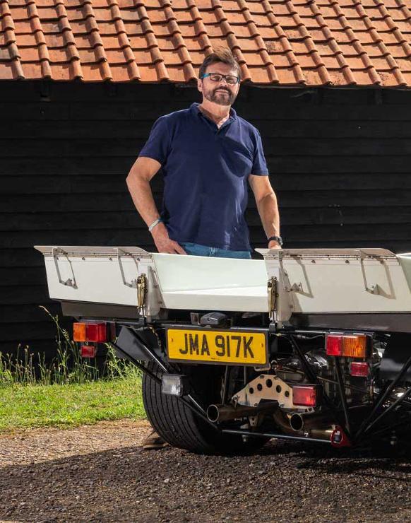 John Hartland stood next to his Porsche 917k Recreation